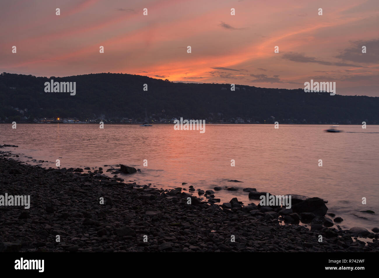 The Village of Piermont lighting up for the night beyond the shores of