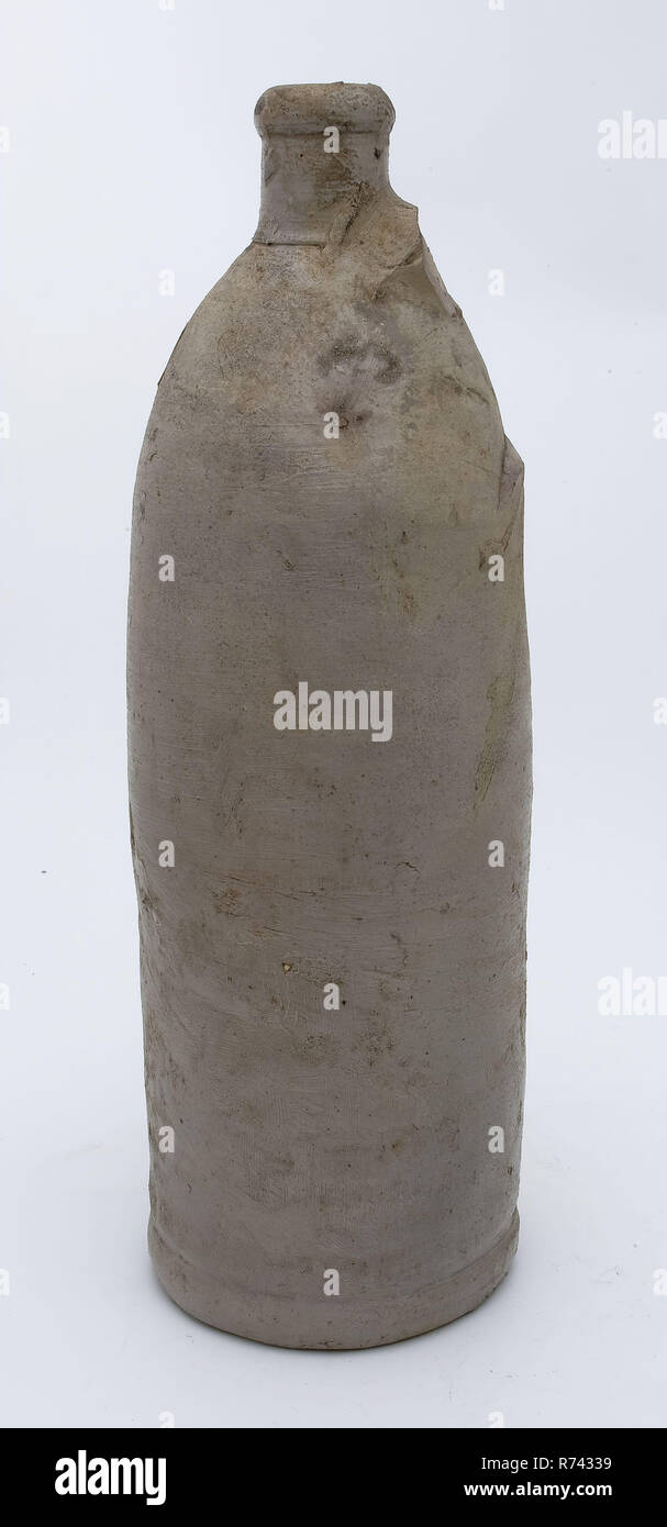 Stoneware mineral water bottle on stand surface, cylindrical, unnoticed, gray, mineral pitcher pitcher pitcher container soil find ceramic stoneware icing salt enamel, hand-turned baked glazed stoneware mineral water pitcher gray shard with salt glaze sausage ear traces on the underside Cylindrical jug with gradual transition to the short neck Rotation of the entire height. Thickened neckline archeology health care import pottery packing serve drink medicine drug pharmacy Stock Photo