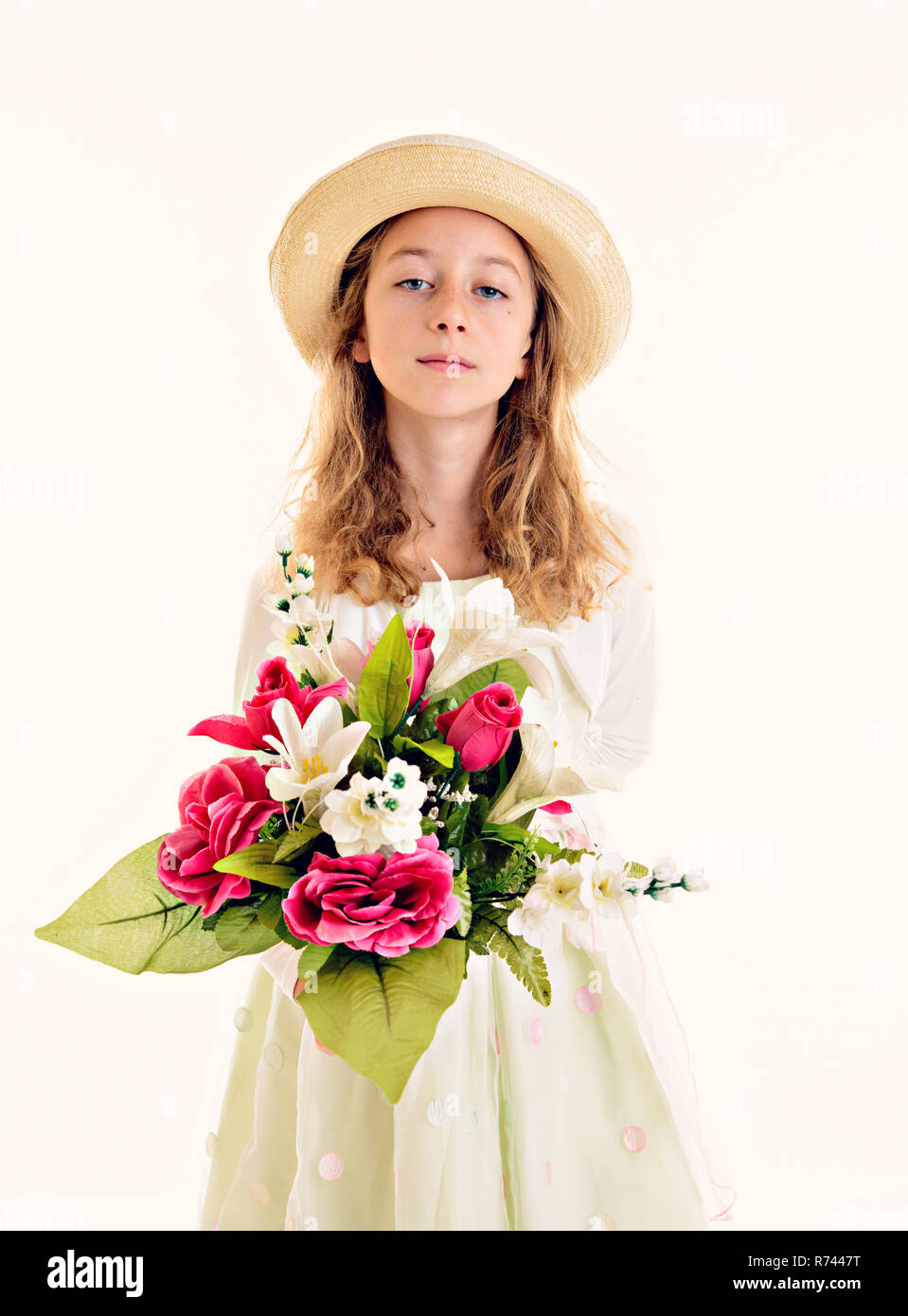 blond girl in white dress and straw hat with bouquet of flowers Stock ...