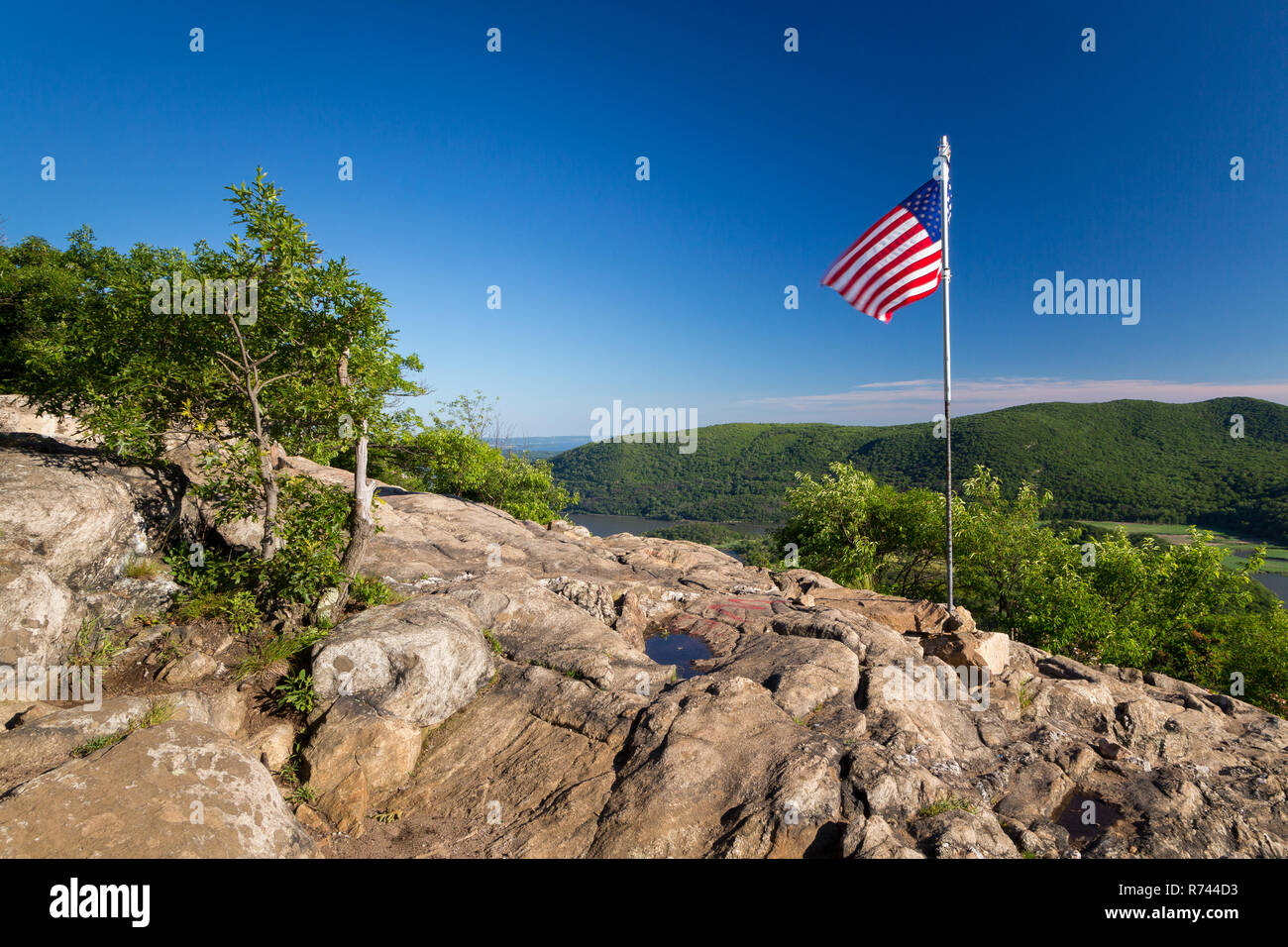 The American flag flying above the Hudson Highlands on the summit of