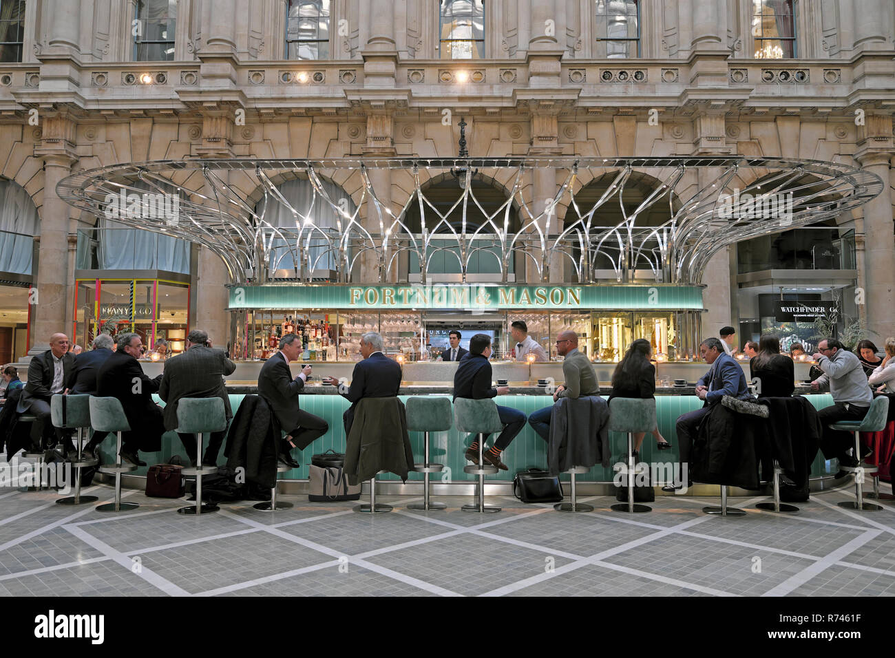 Fortnum & Mason bar at Christmas time businessmen and women sitting inside the Royal Exchange and Bank of England City of London UK  KATHY DEWITT Stock Photo
