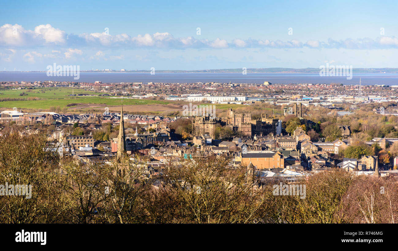 Lancaster, England, UK - November 12, 2017: Winter sun shines on the cityscape of Lancaster and Morecambe, including Lancaster Castle and Cathedral, a Stock Photo
