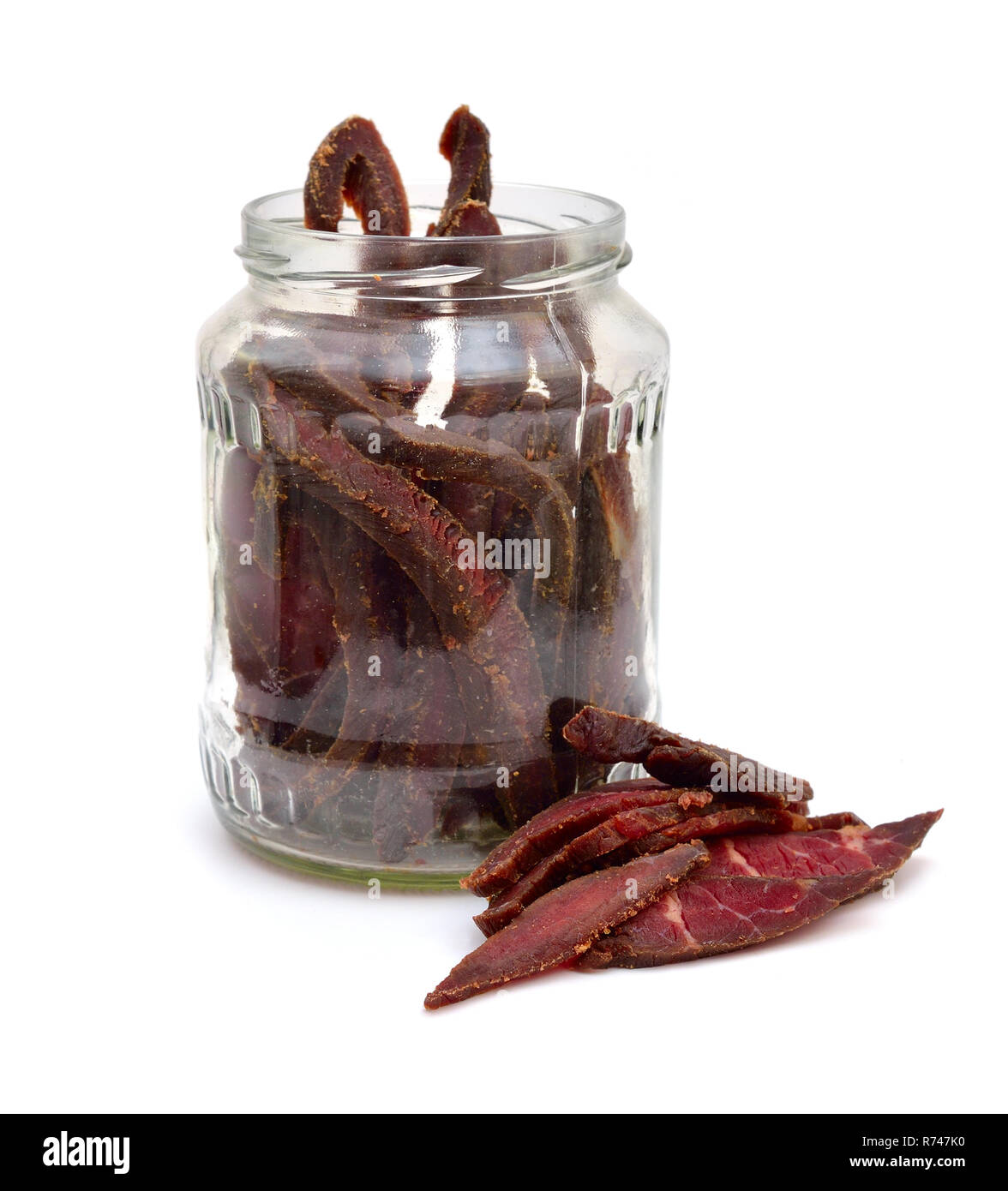 Beef Jerky in a glass jar isolated on white background Stock Photo Alamy