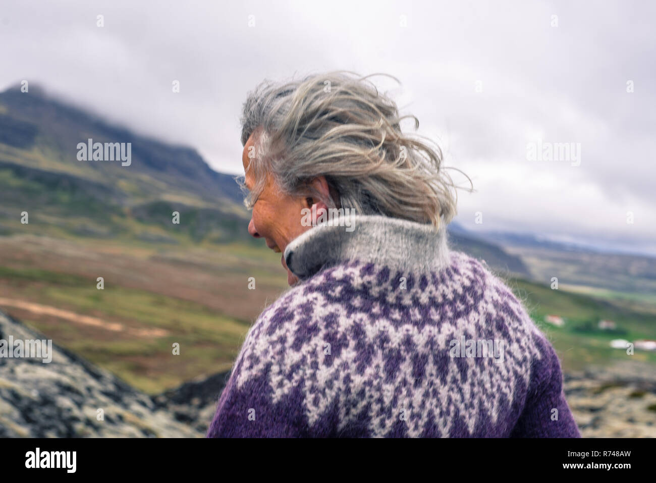 Woman walking around Grabrok volcano, Iceland Stock Photo