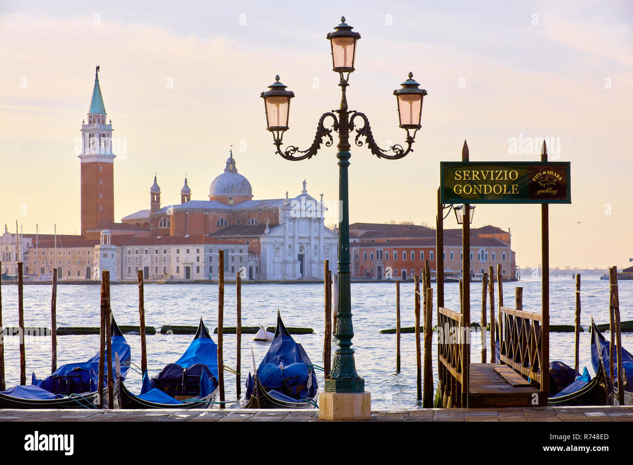 Gondolas on St Marks square waterfront with San Giorgio Maggiore church in background, Venice, Veneto, Italy Stock Photo