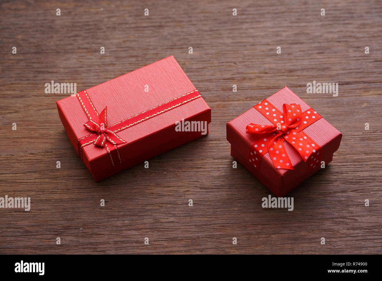 Two red gift boxes on wood table Stock Photo