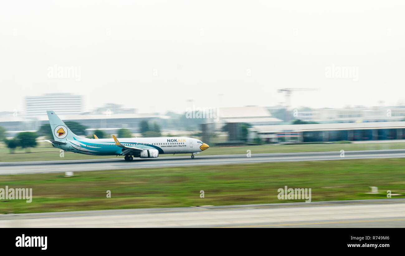 Nok Air plane landing at Bangkok airport, Thailand Stock Photo