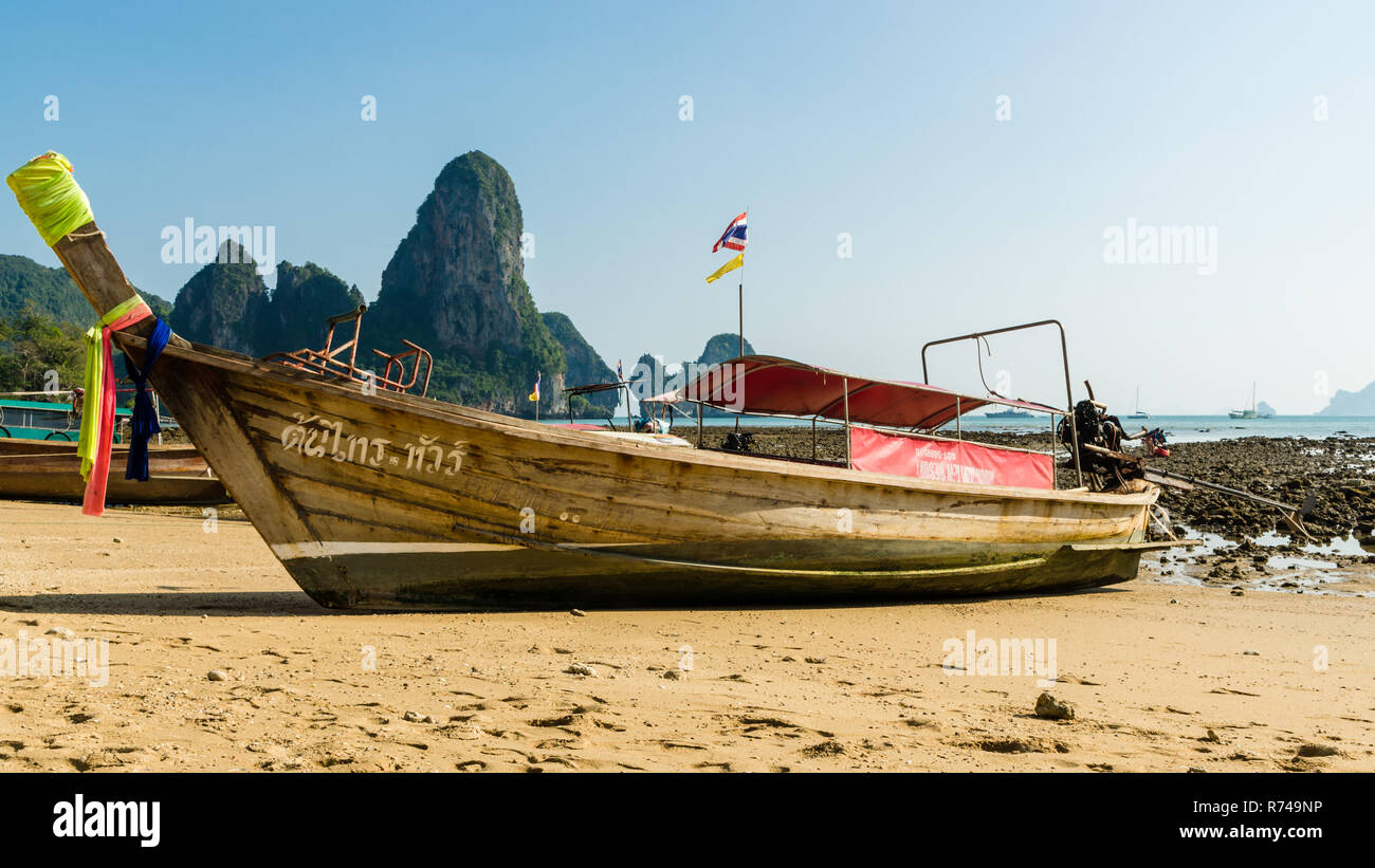 Longtail boat on the beach at low tide, Tonsai beach, Thailand Stock Photo