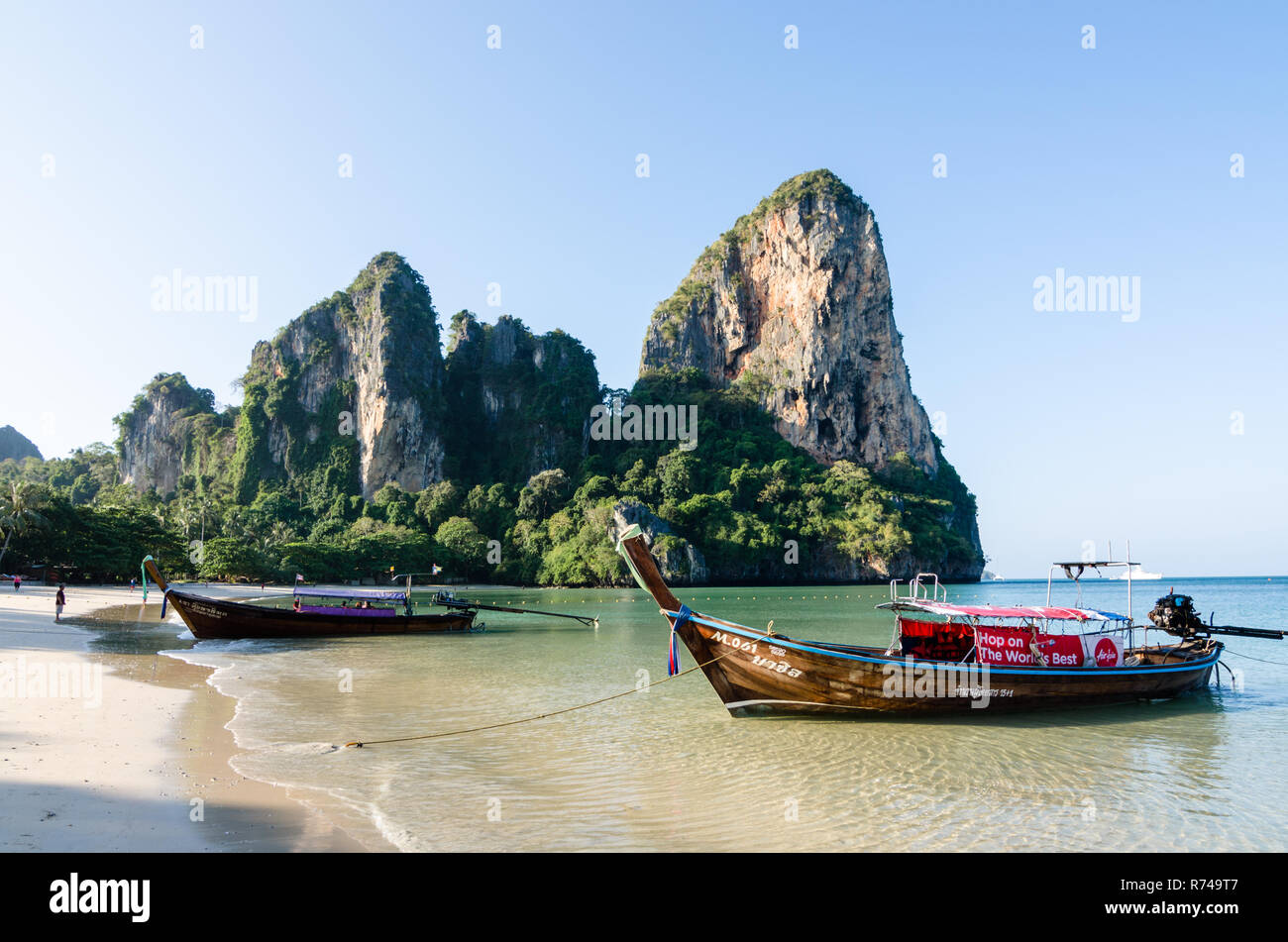 Limestone karsts and longtail boats, Railay beach, Thailand Stock Photo