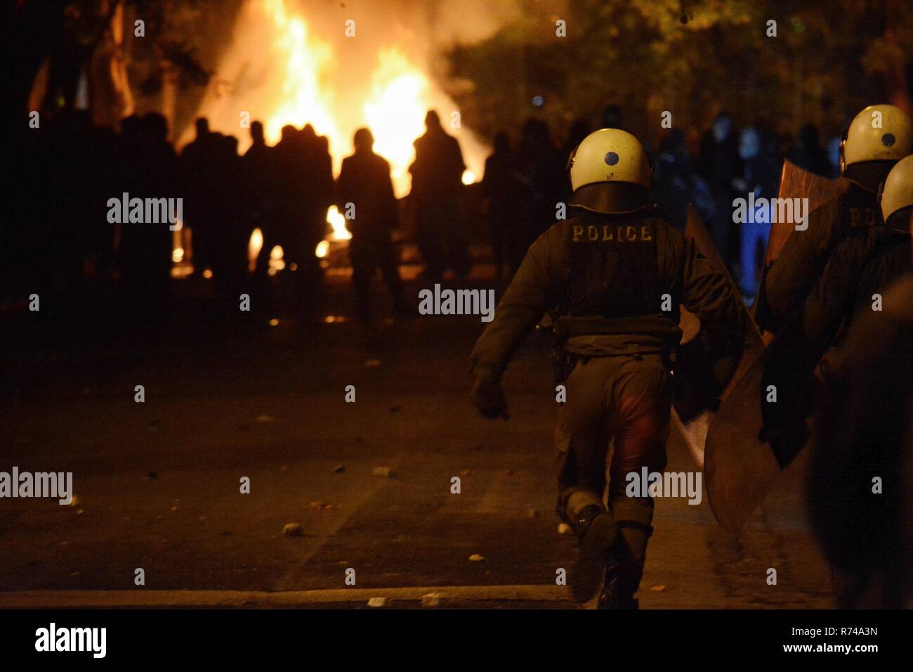 Riot policemen seen with their armor during the riots. Anarchists riot at the area of Exarchia during the demonstration of the 10th Anniversary of Alexandros Grigoropoulos who was killed by policeman. Stock Photo