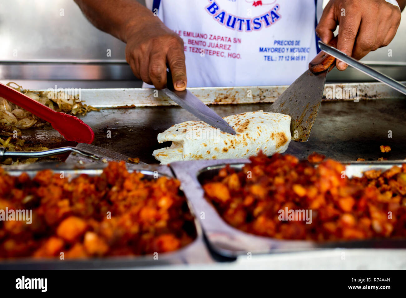 A burrito being prepared at a street food stall in Mexico City, Mexico