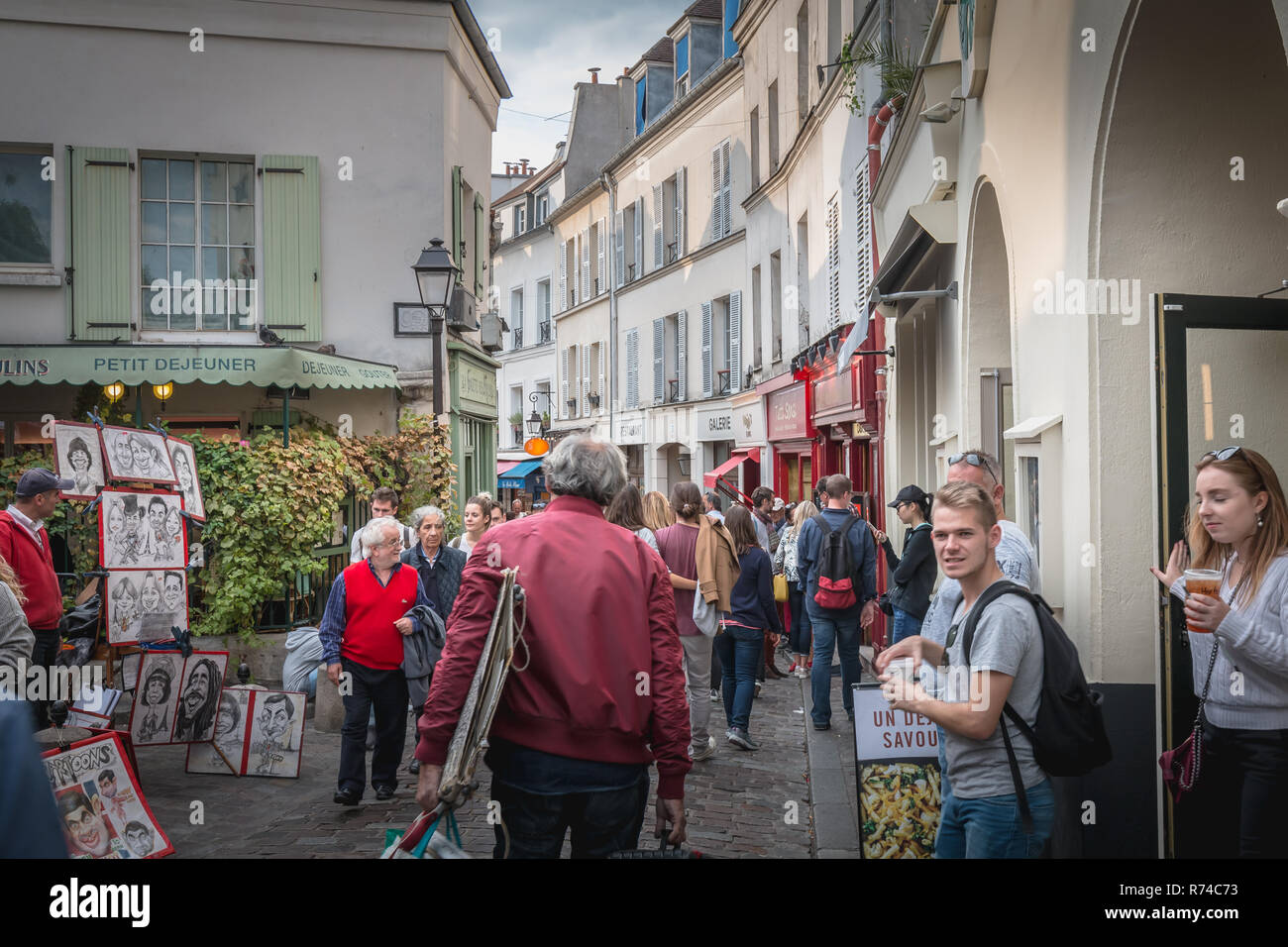 Paris, France - October 6, 2018: street atmosphere on the famous Place du Tertre in Montmartre where artists exhibit their work for curious passers-by Stock Photo