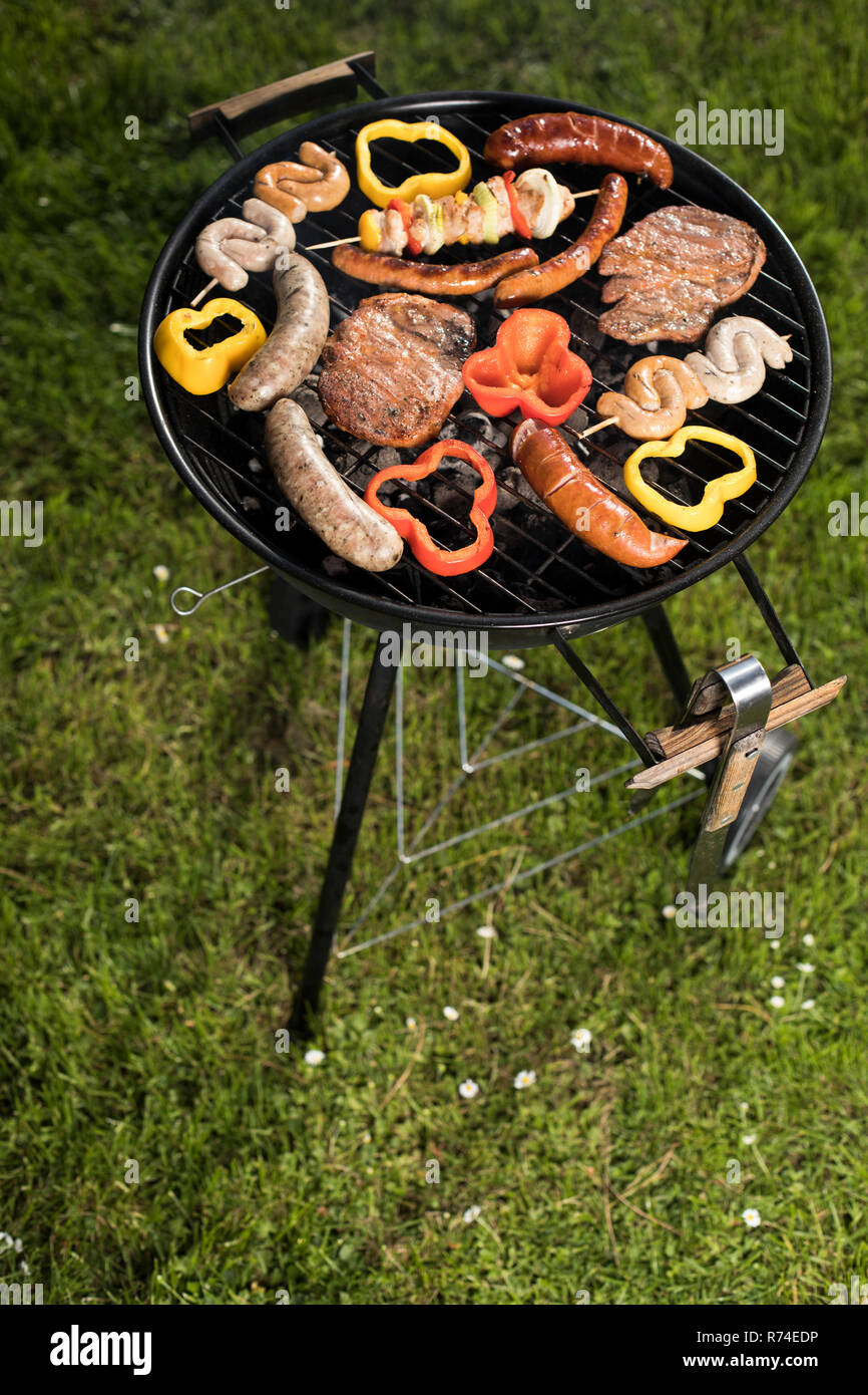 Grill with smoke over summer outdoor nature in garden Stock Photo - Alamy