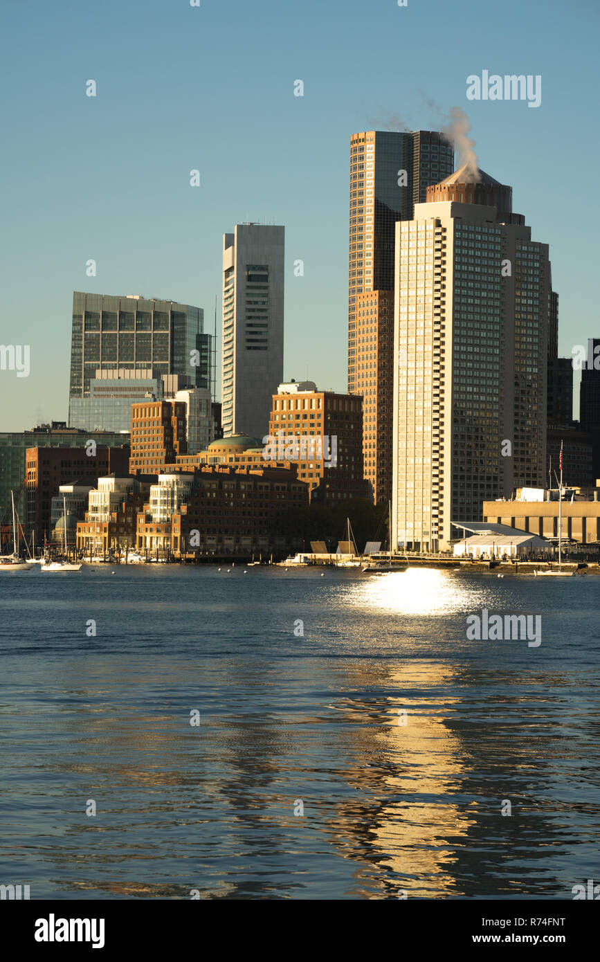 View Across Boston Harbor to the Boat Traffic fronting the Downtown City Skyline Stock Photo