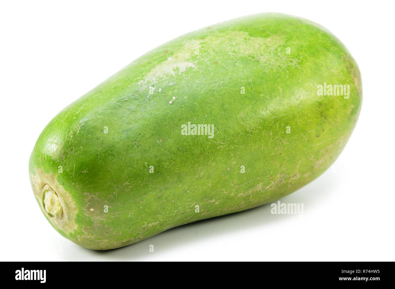 Green papaya isolated Stock Photo - Alamy