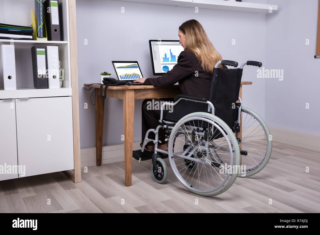 Disabled Businesswoman Working On Computer Stock Photo Alamy
