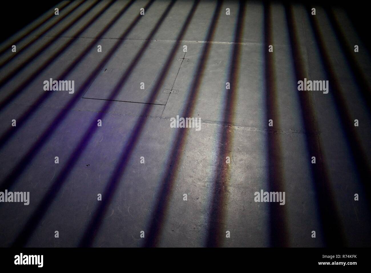 Vertical black shadow lines in abstract on a grey floor Stock Photo - Alamy