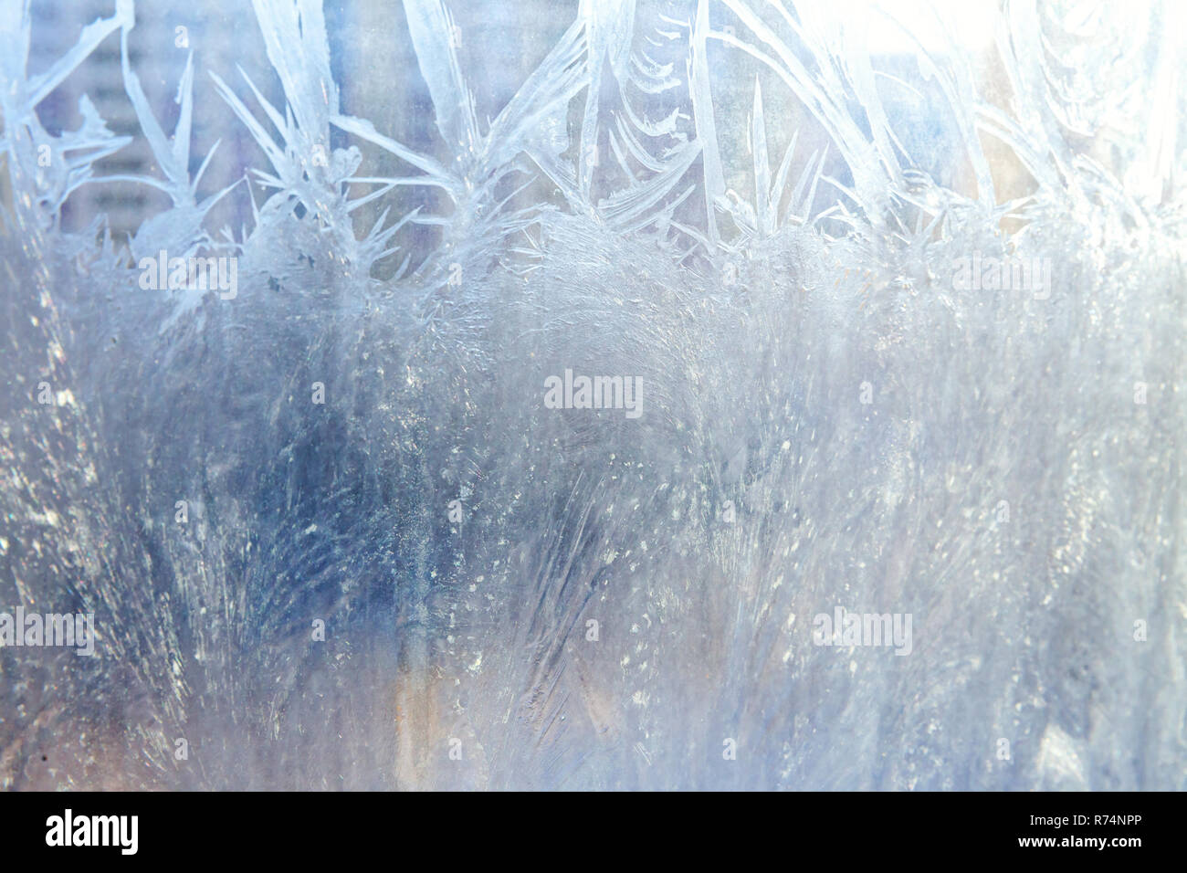 Frozen winter window with shiny ice frost pattern texture. Christmas ...