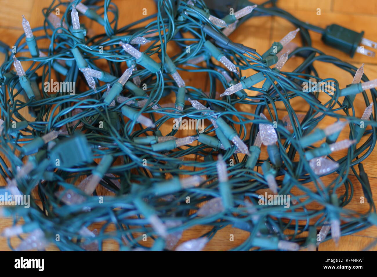 Tangled Christmas lights on the floor Stock Photo Alamy