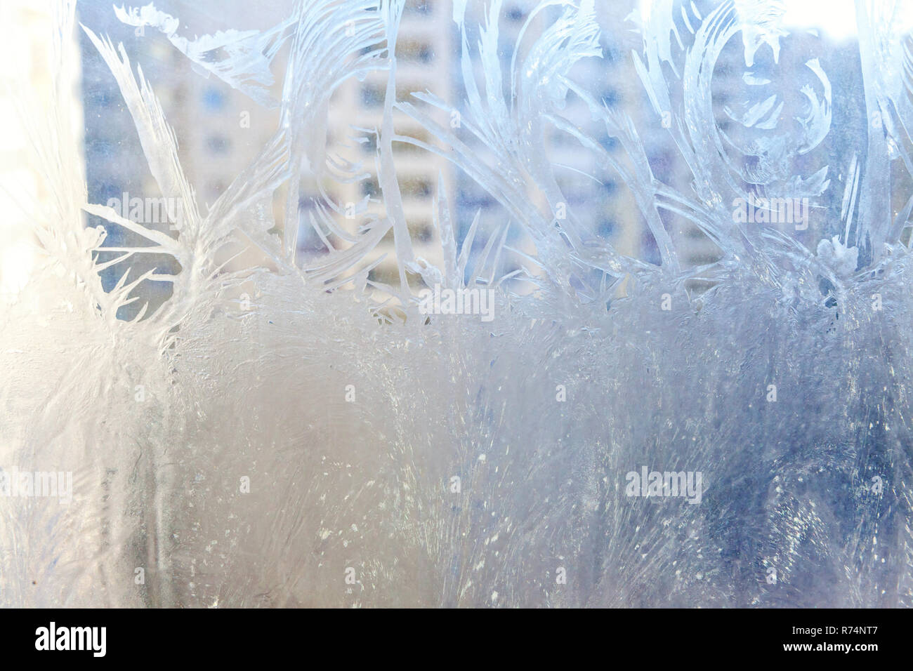 Frozen winter window with shiny ice frost pattern texture. Christmas ...