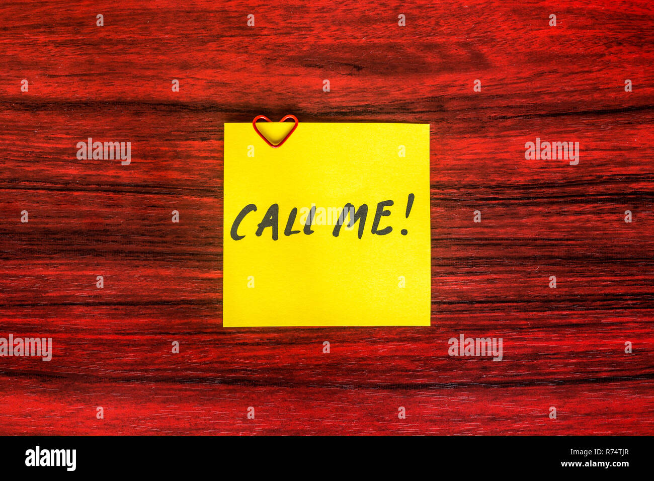 Sticky Note Call Me Heart shaped paper clip on a yellow sticky note with the words Call me ...