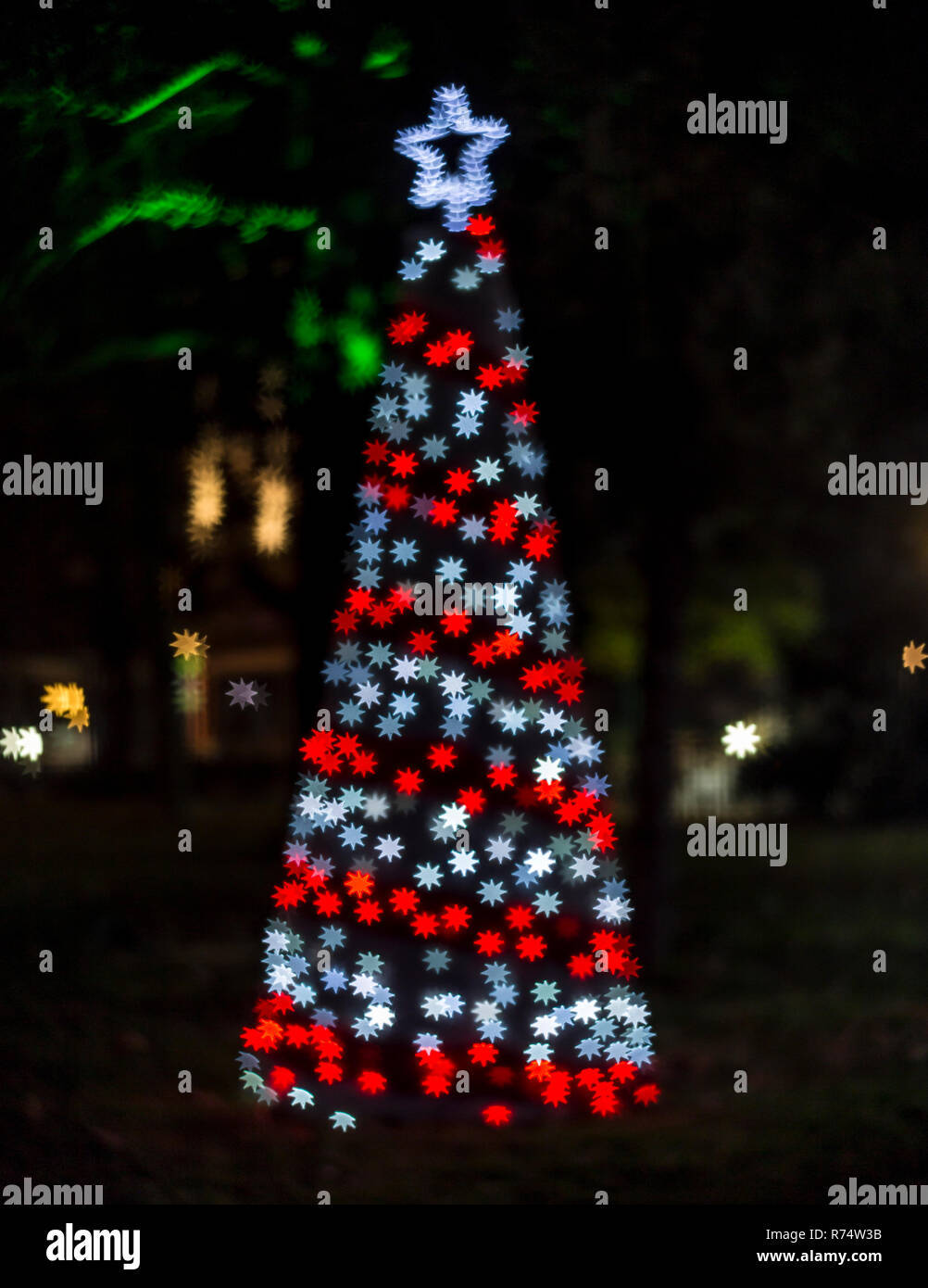 Christmas tree with star shaped bokeh lights Stock Photo