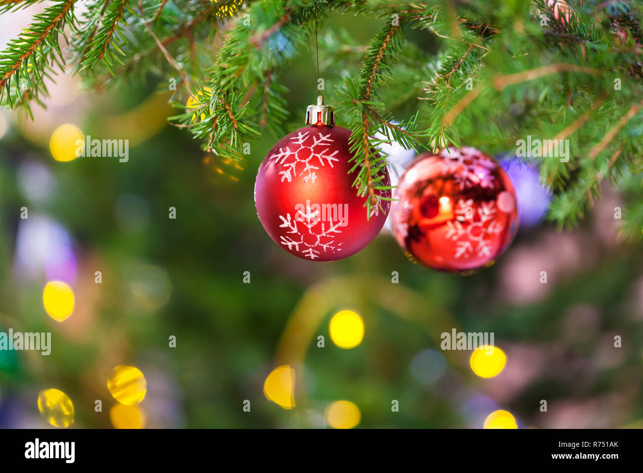 two balls with snowflake on fresh christmas tree Stock Photo - Alamy