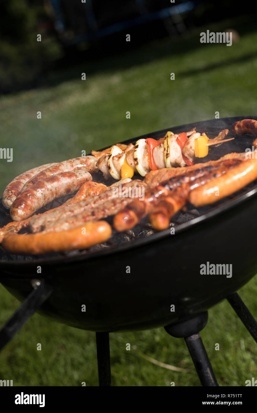 Grill with smoke over summer outdoor nature in garden Stock Photo - Alamy