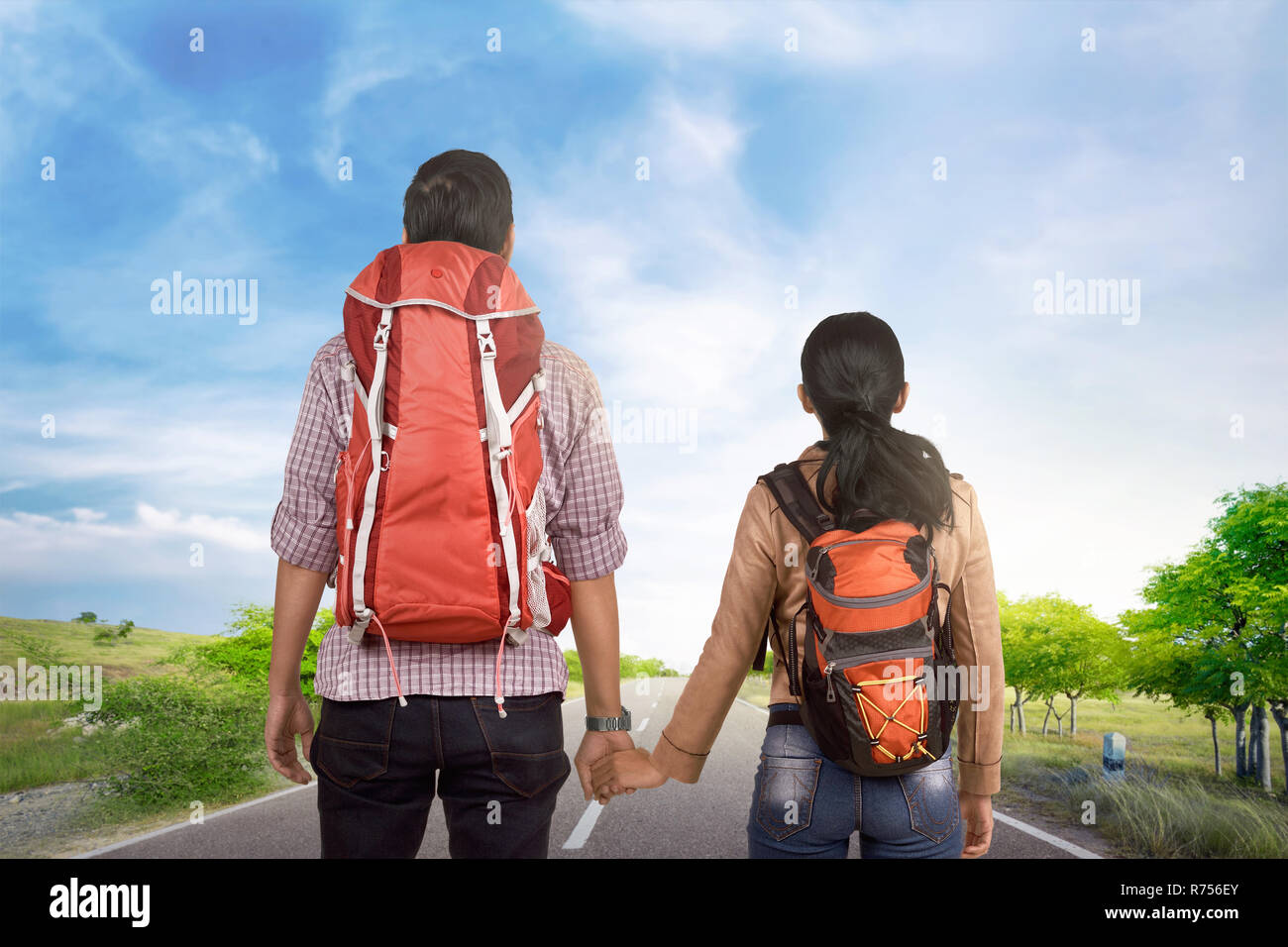 Romantic asian tourist couple holding hands and walking Stock Photo - Alamy