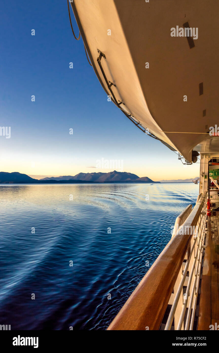 Beautiful crisp and clear morning light at early dawn sunrise passing over gentle water ripples from cruise ship Starboard wake. Photographed from Pro Stock Photo