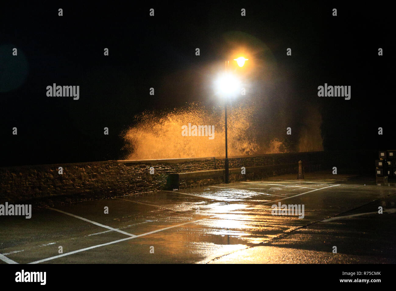 Very strong winds coincided with high tides in the North Devon coastal town of Ilfracombe this evening. Stock Photo