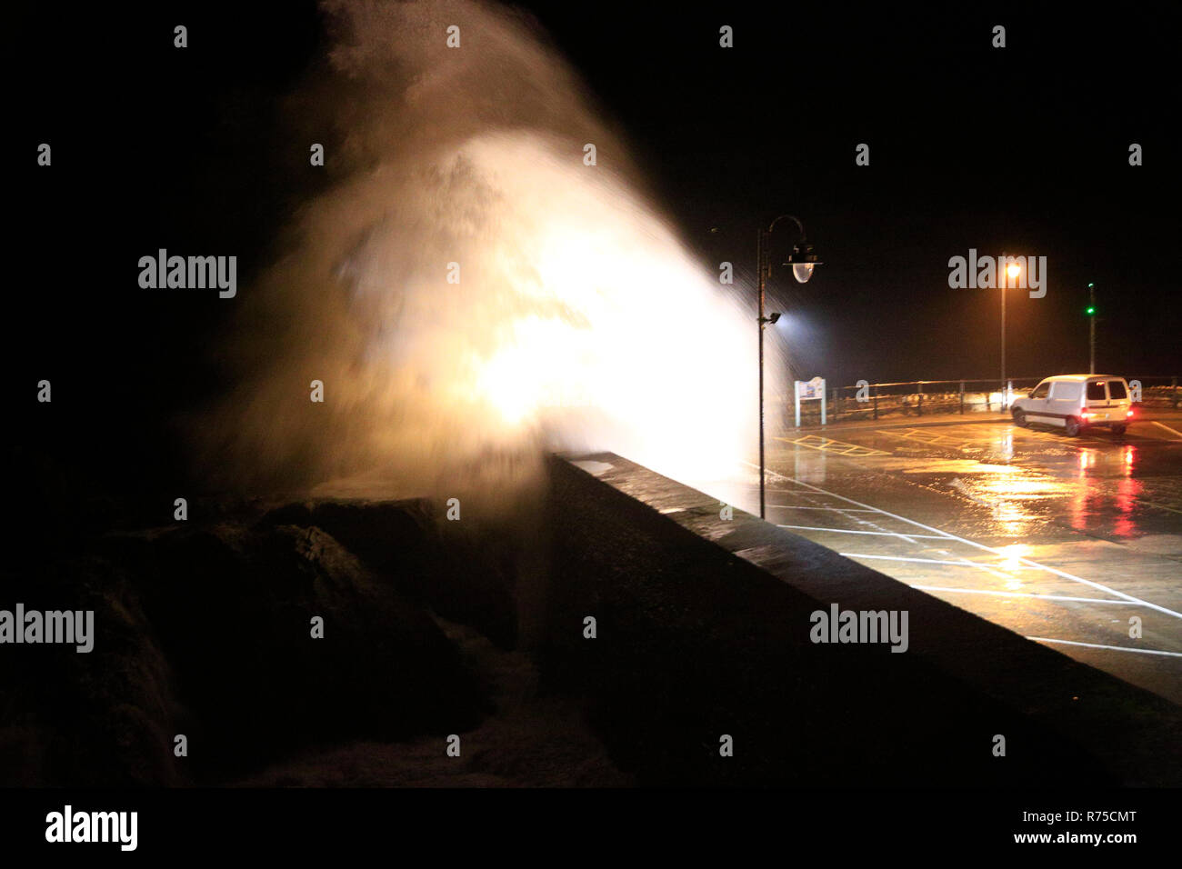 Very strong winds coincided with high tides in the North Devon coastal town of Ilfracombe this evening. Stock Photo