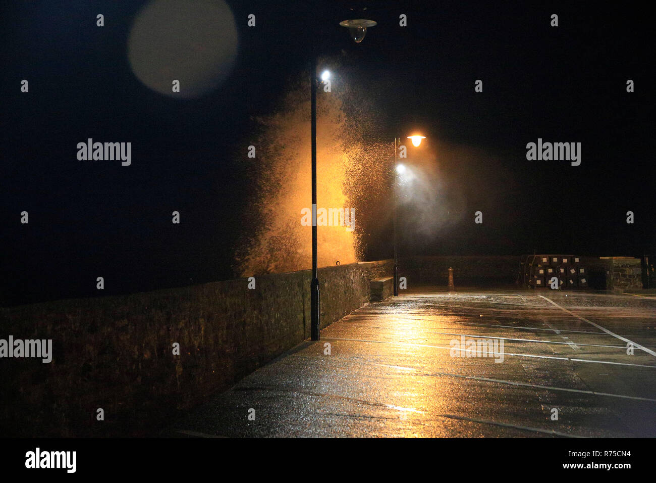 Very strong winds coincided with high tides in the North Devon coastal town of Ilfracombe this evening. Stock Photo