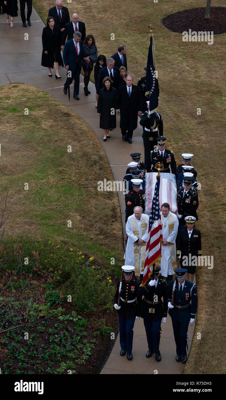 The flag draped casket of former president George H.W. Bush is carried by a joint services honor guard with the Bush Family in procession to his presidential library at Texas A&M University December 6, 2018 in College Park, Texas. Stock Photo