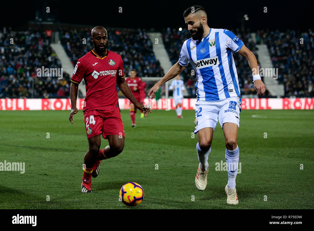 CD Leganes's Dimitrios Siovas and Getafe CF's Dimitri Foulquier fight for the ball during La Liga match between CD Leganes and Getafe CF at Butarque Stadium in Leganes, Spain. (Final score: CD Leganes 1 - 1 Getafe CF) Stock Photo