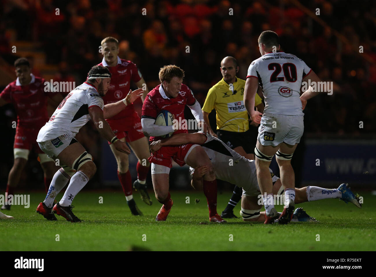 Llanelli, UK. 07th Dec, 2018. Rhys Patchell of the Scarlets Credit: is tackled.Scarlets v Ulster rugby, Heineken European Champions Cup, pool 4 match at Parc y Scarlets in Llanelli, South Wales on Friday 7th December 2018. picture by Andrew Orchard/Andrew Orchard sports photography/Alamy Live News Stock Photo