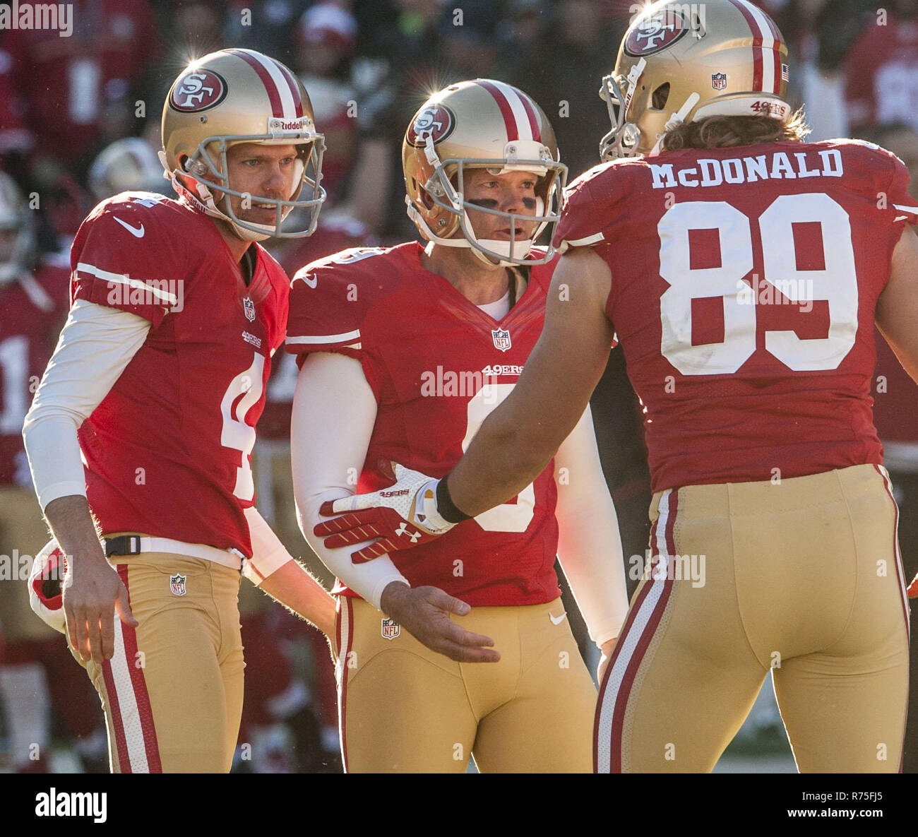 San Francisco, California, USA. 8th Dec, 2013. San Francisco 49ers punter Andy Lee (4) and tight end Vance McDonald (89) congratulates kicker Phil Dawson (9) after making field goal on Sunday, December 8, 2013 in San Francisco, California. The 49ers defeated the Seahawks. 19-17. Credit: Al Golub/ZUMA Wire/Alamy Live News Stock Photo
