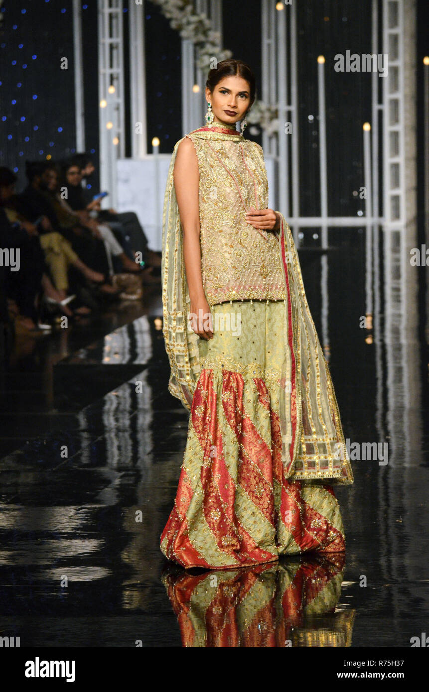 Lahore. 7th Dec, 2018. A model presents a creation by designer Reema Ahsan on the first day of Bridal Couture Week in eastern Pakistan's Lahore on Dec. 7, 2018. Credit: Jamil Ahmed/Xinhua/Alamy Live News Stock Photo