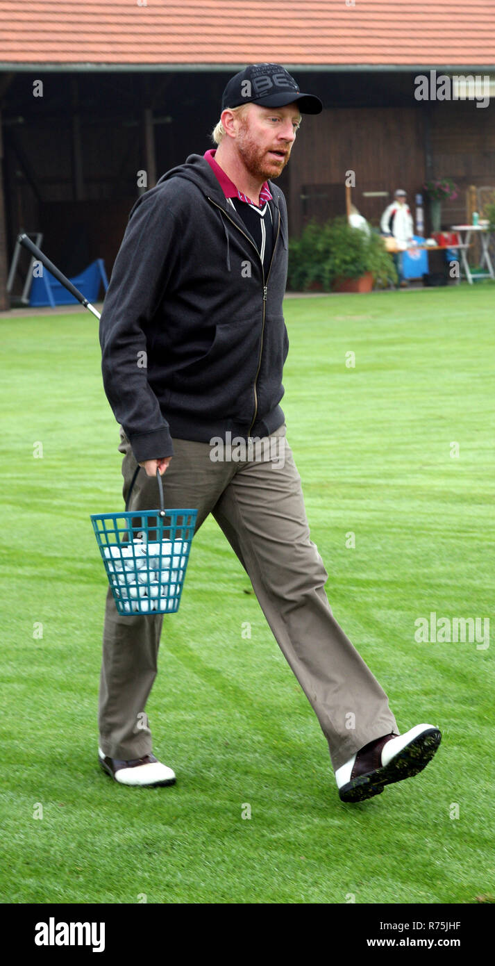 Munich, Germany. 28th Sep, 2008. The picture shows former tennis professional Boris Becker carrying golf balls during the 'Boris Becker Oktoberfest Golf Trophy' for the benefit of the Clever-Becker foundation on the golf course of Schloss Egmating, 30 kilometres to the southeast of Munich, Germany, 28 September 2008. The 'Oktoberfest Golf Trophy' takes place for the sixth time. Credit: Ursula Dueren | usage worldwide/dpa/Alamy Live News Stock Photo