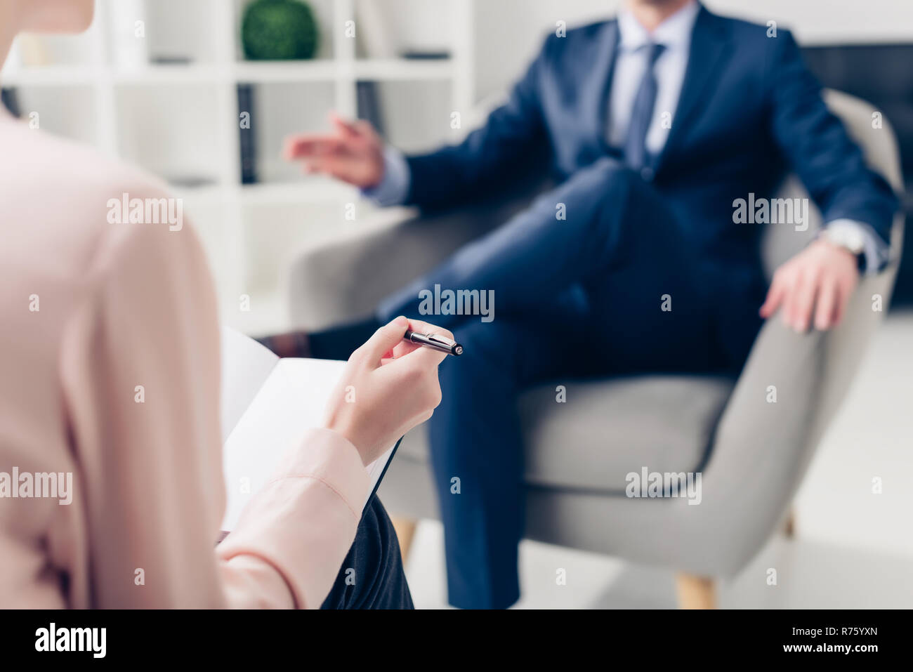 cropped image of businessman giving interview to journalist in office Stock Photo
