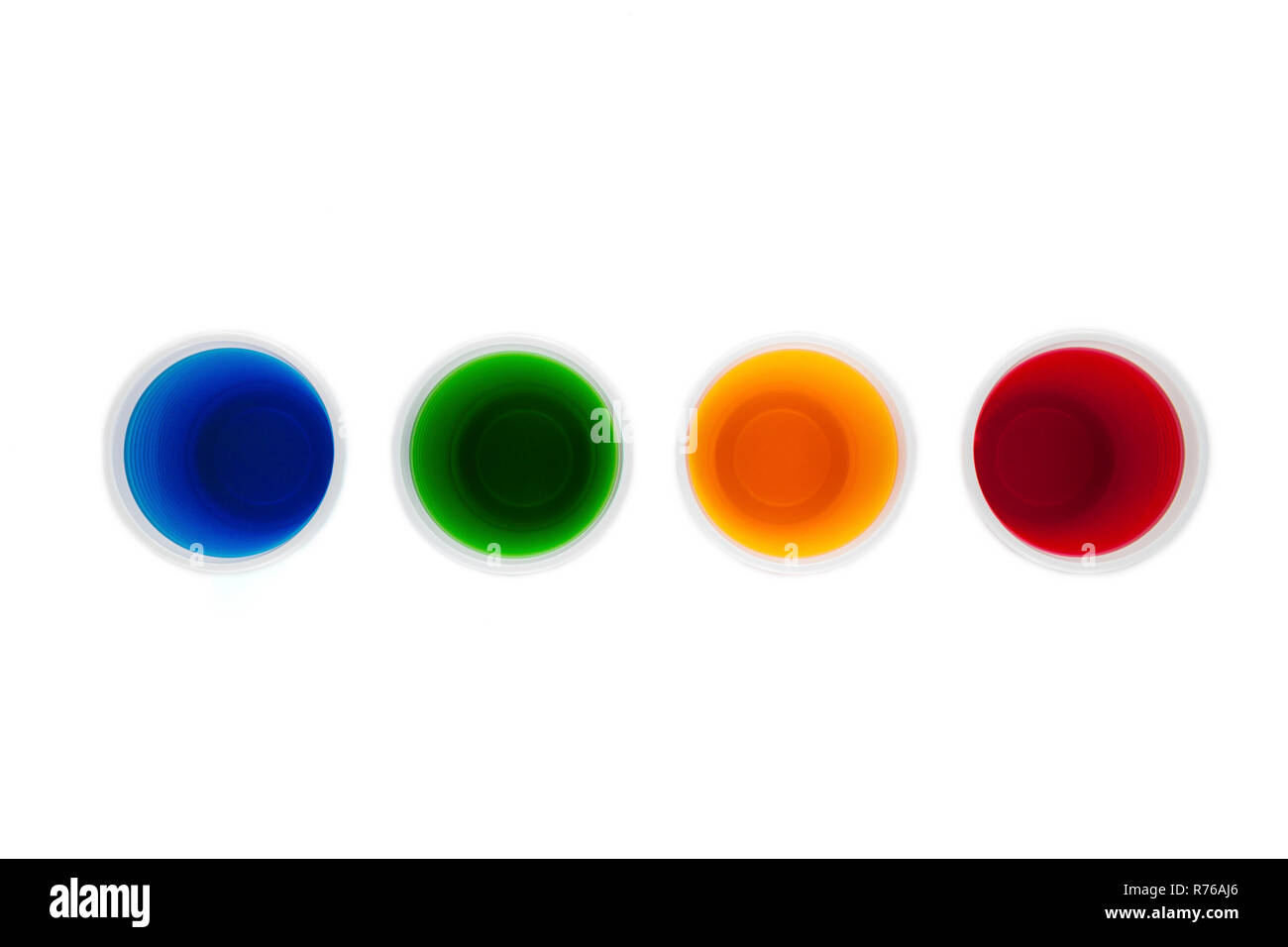 Plastic cups filled with different collored water Stock Photo