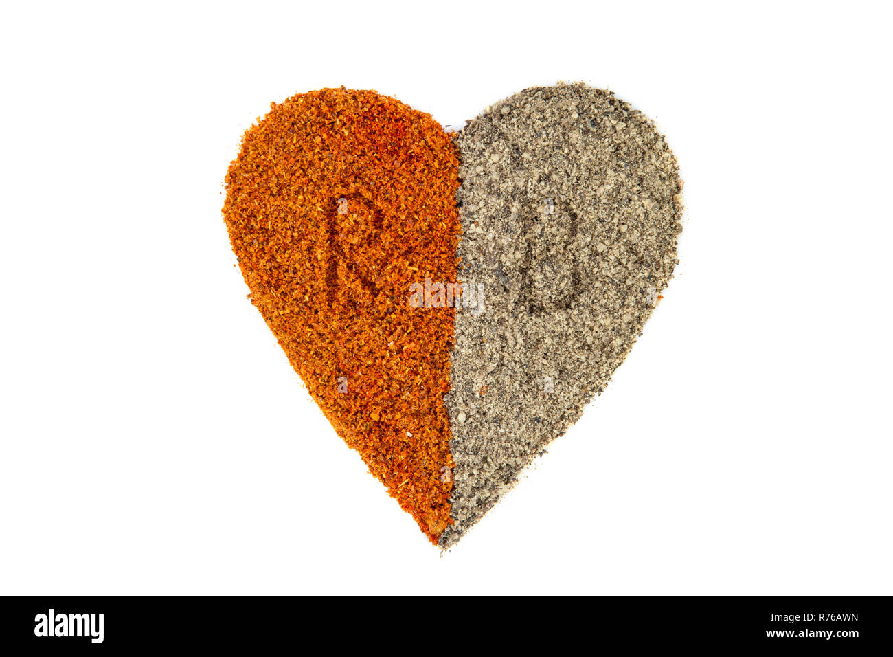 Heart shape made of red and black pepper powder with the letters R ...