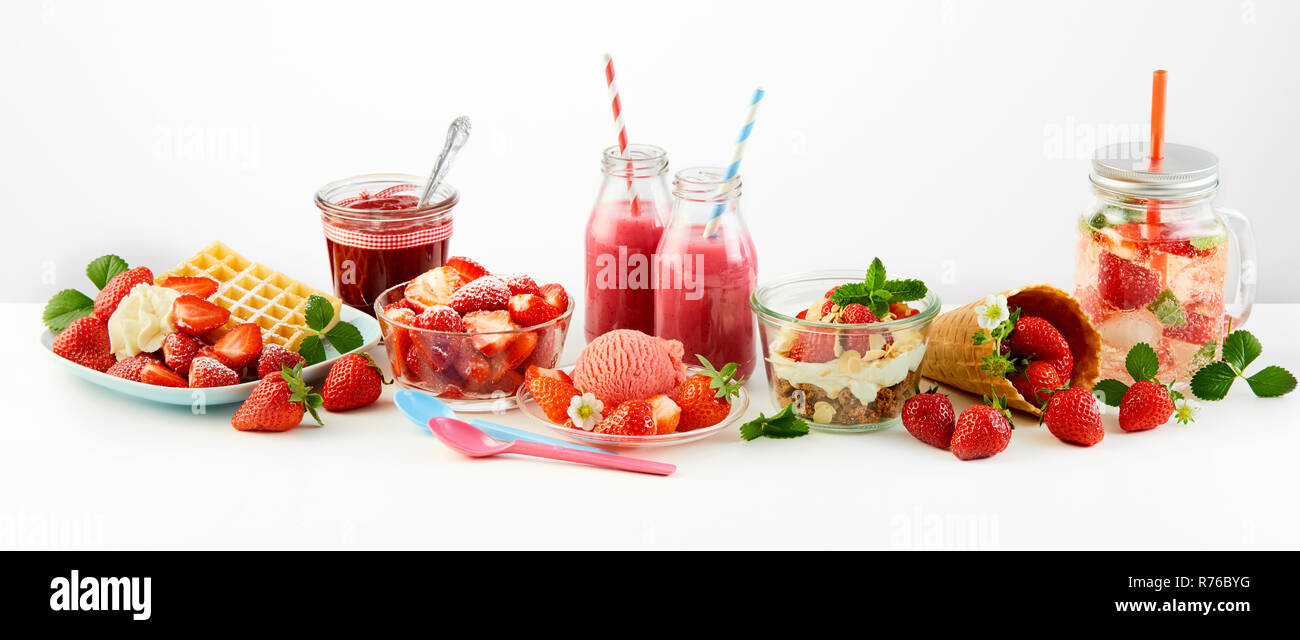 Strawberry themed panorama of fresh fruit recipes Stock Photo