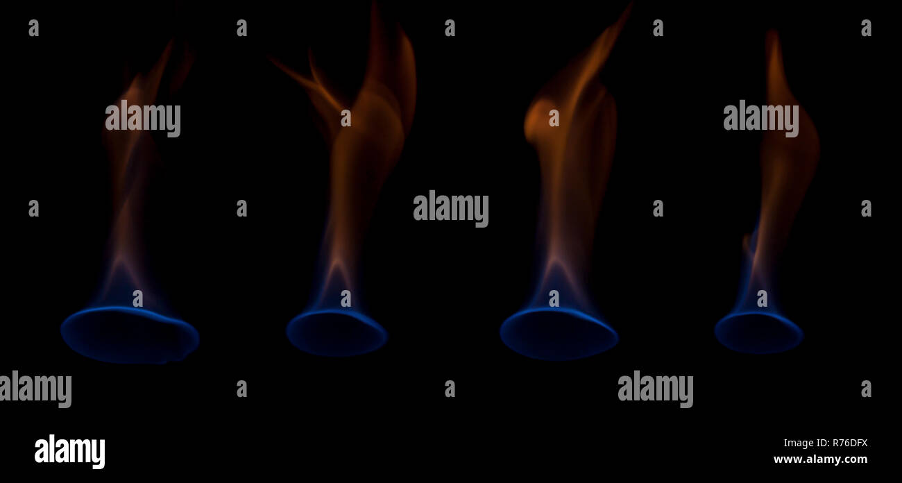 Blue and yellow colored flames isolated on black background Stock Photo