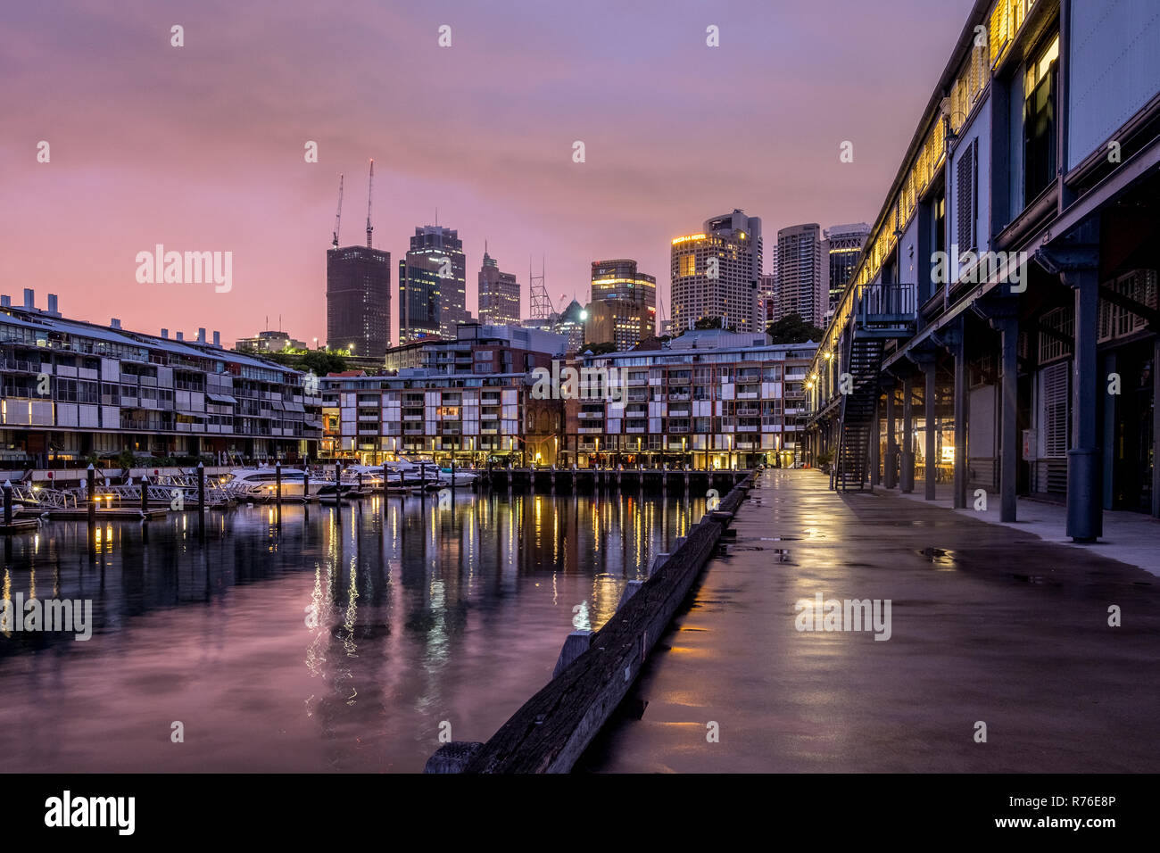Luxury apartments on Sydney Harbour our at dawn - Sydney City in the background Stock Photo