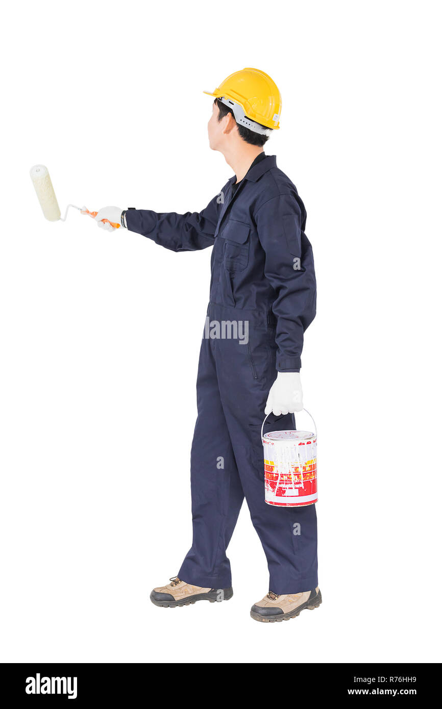 Worker in uniform using paint roller is painting invisible wall Stock Photo