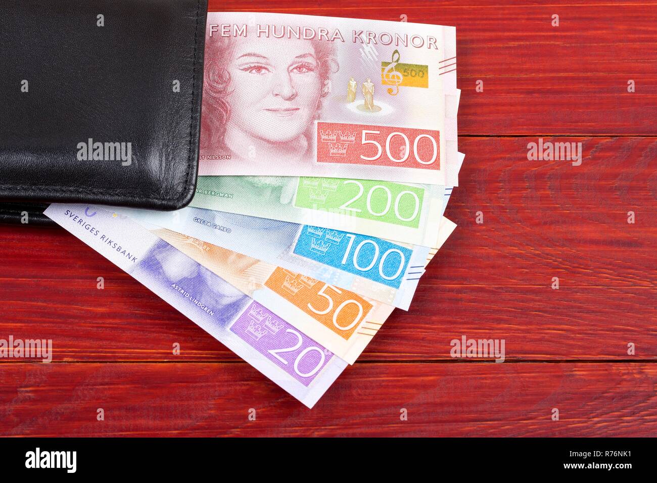 Money from Sweden in the black wallet Stock Photo - Alamy