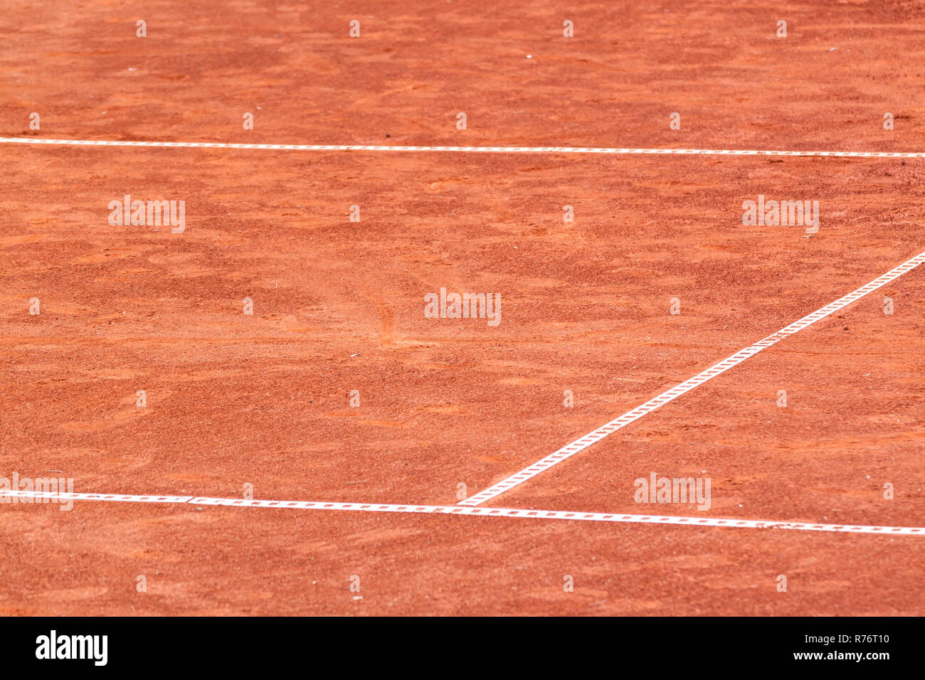 Clay tennis court with white plastic lines Stock Photo - Alamy