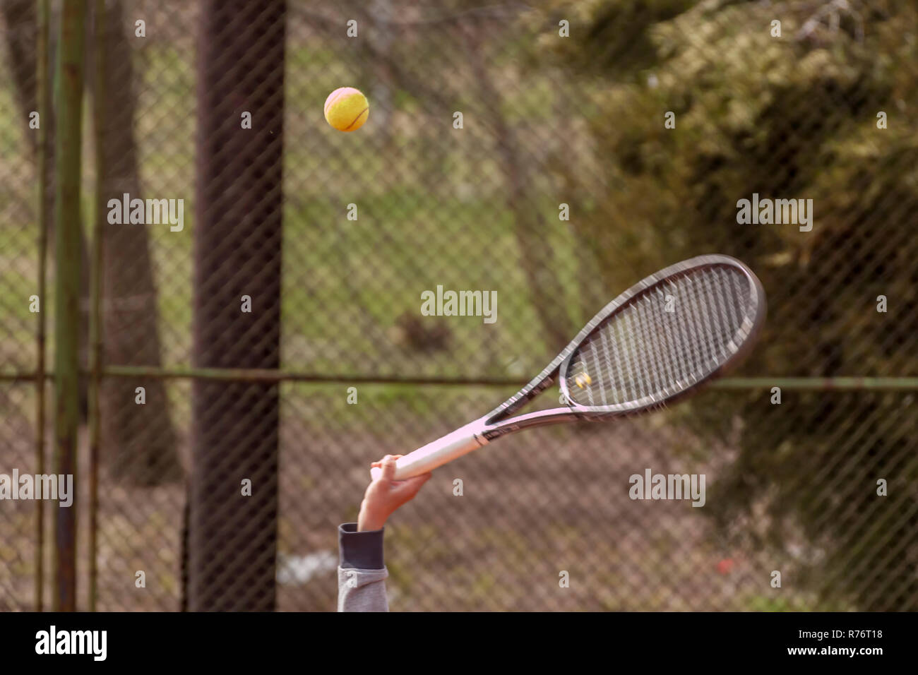 Tennis racket hitting a tennis ball Stock Photo Alamy