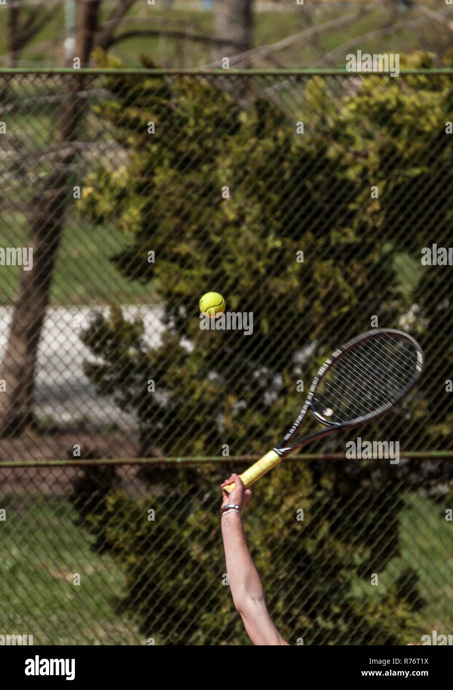 Tennis racket hitting a tennis ball Stock Photo Alamy